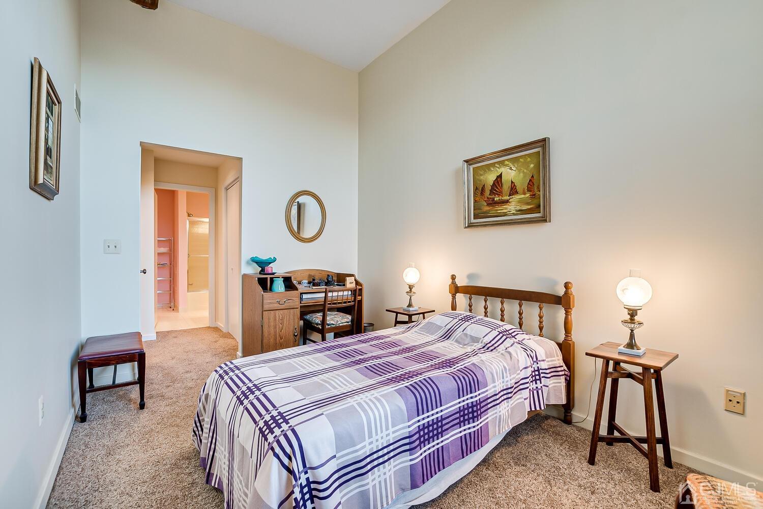 40 Washington Avenue, Unit 9 Milltown, NJ 08850 - Photo 38 of 43 a bedroom with a bed and wooden floor