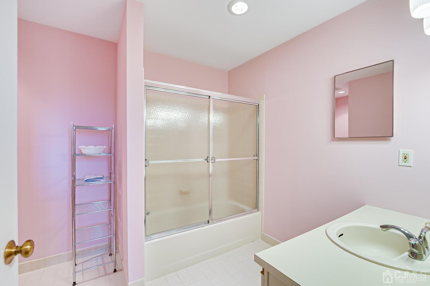 40 Washington Avenue, Unit 9 Milltown, NJ 08850 - Photo 39 of 43 a bathroom with a sink and a mirror