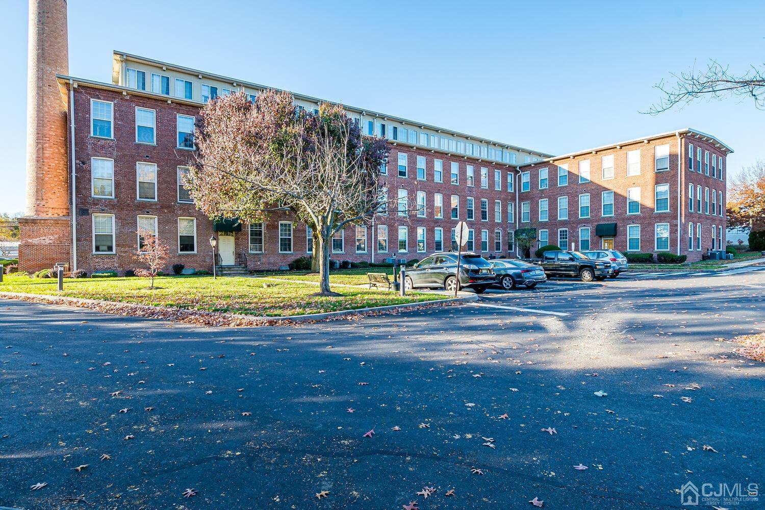 40 Washington Avenue, Unit 9 Milltown, NJ 08850 - Photo 41 of 43 a swimming pool with outdoor seating and yard