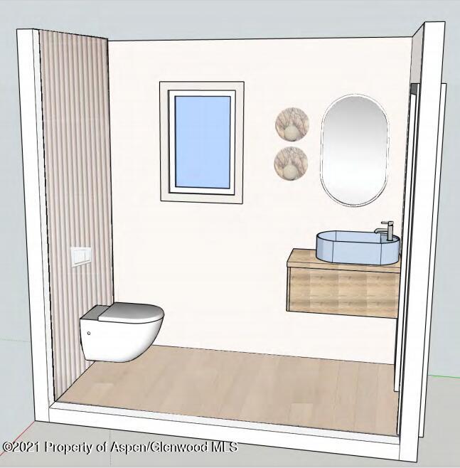 260 Meadow Ranch Road, Unit C21 Snowmass Village, CO 81615 - Photo 8 of 18 a bathroom with a toilet a sink and mirror