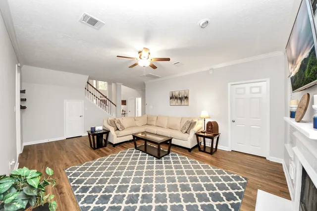 a kitchen with stainless steel appliances granite countertop sink stove refrigerator and cabinets
