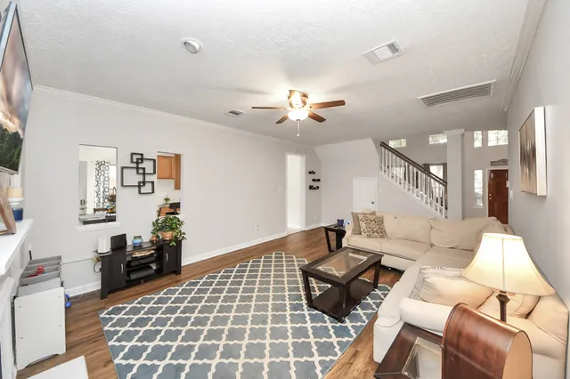 a kitchen with stainless steel appliances granite countertop a sink stove and microwave