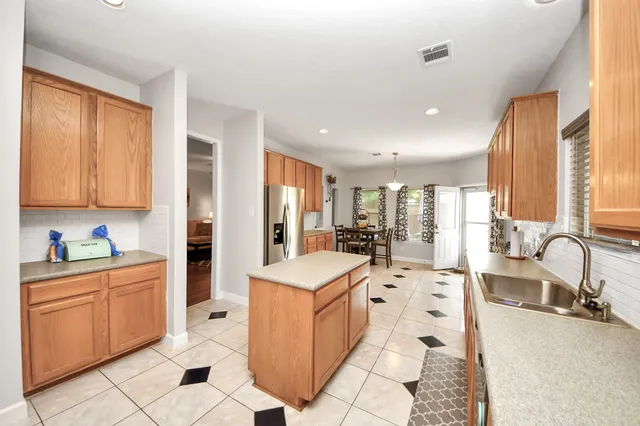 a white bath tub sitting next to a bathroom sink