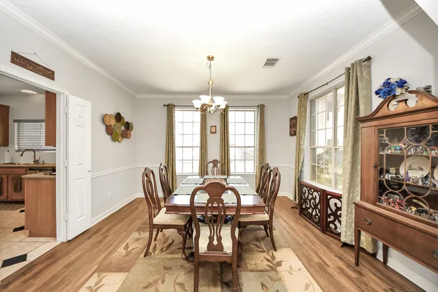 a view of a dining room with furniture and window