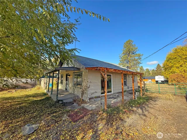 a backyard of a house with seating space