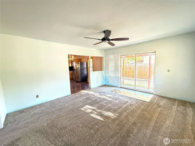 a view of an empty room with a window