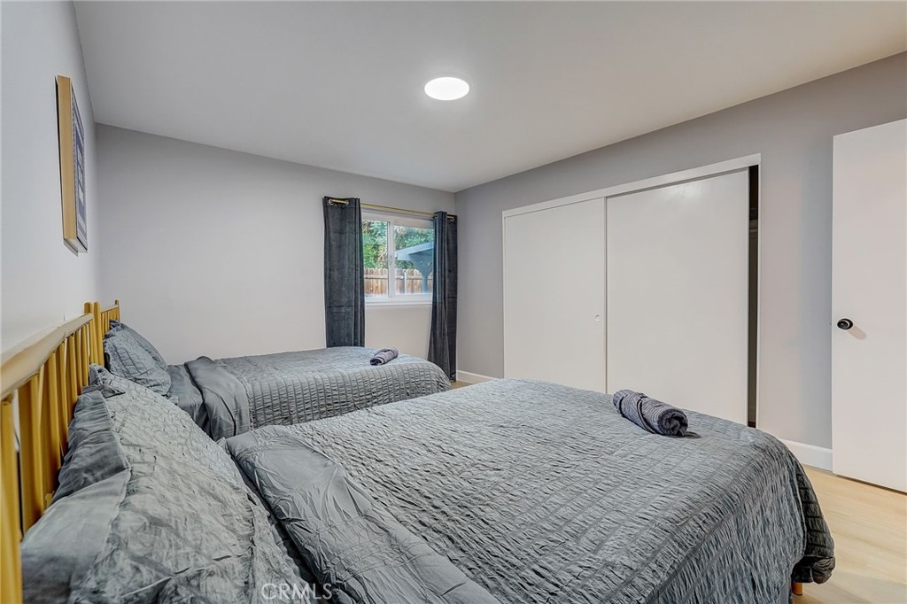 5030 Kensington Way Riverside, CA 92507 - Photo 12 of 18 a bedroom with a bed and a window