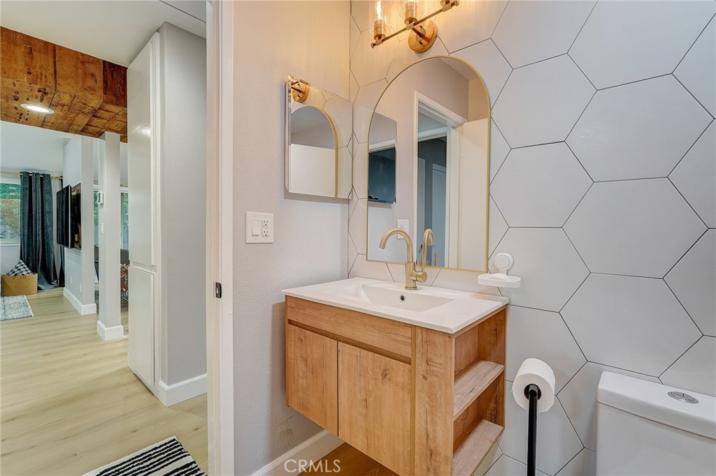 5030 Kensington Way Riverside, CA 92507 - Photo 14 of 18 a bathroom with a sink and a mirror