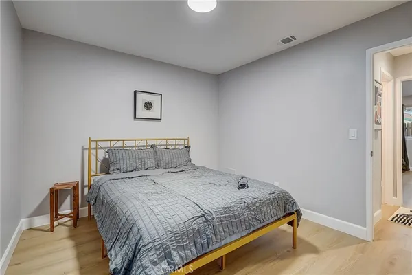 a bed room with two beds and a window