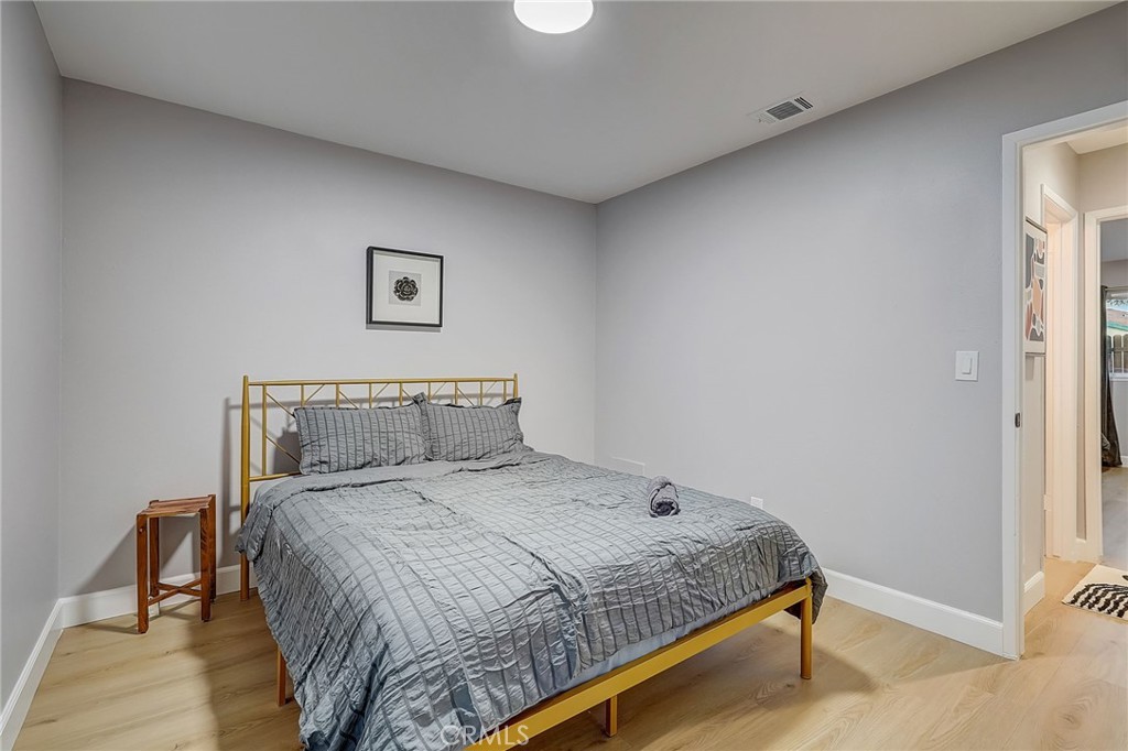 5030 Kensington Way Riverside, CA 92507 - Photo 15 of 18 a bedroom with a bed and a table