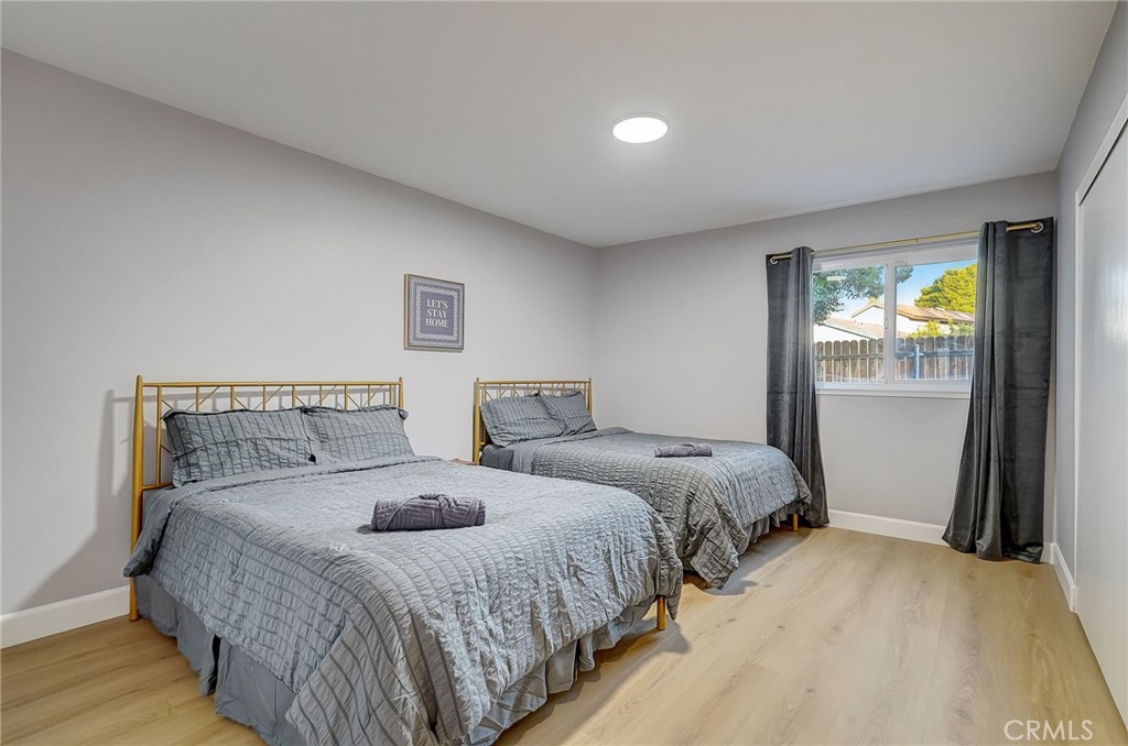 5030 Kensington Way Riverside, CA 92507 - Photo 16 of 18 a bed room with two beds and a window
