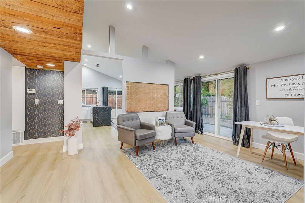 5030 Kensington Way Riverside, CA 92507 - Photo 6 of 18 a living room with furniture rug and wooden floor