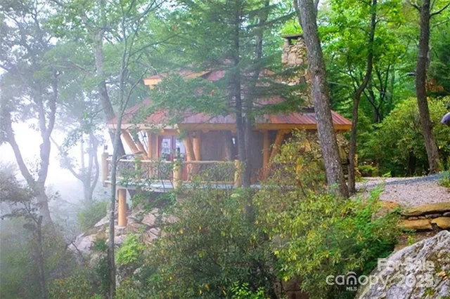 a group of people sitting at tables in a patio