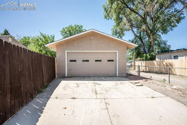 a view of a chair and tables in the backyard