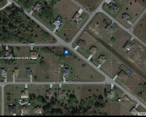 3807 West 24th Lehigh Acres, FL 33971 - Photo 3 of 4 an aerial view of a highlighted house