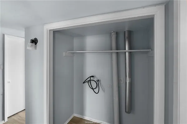 a bathroom with a glass shower door