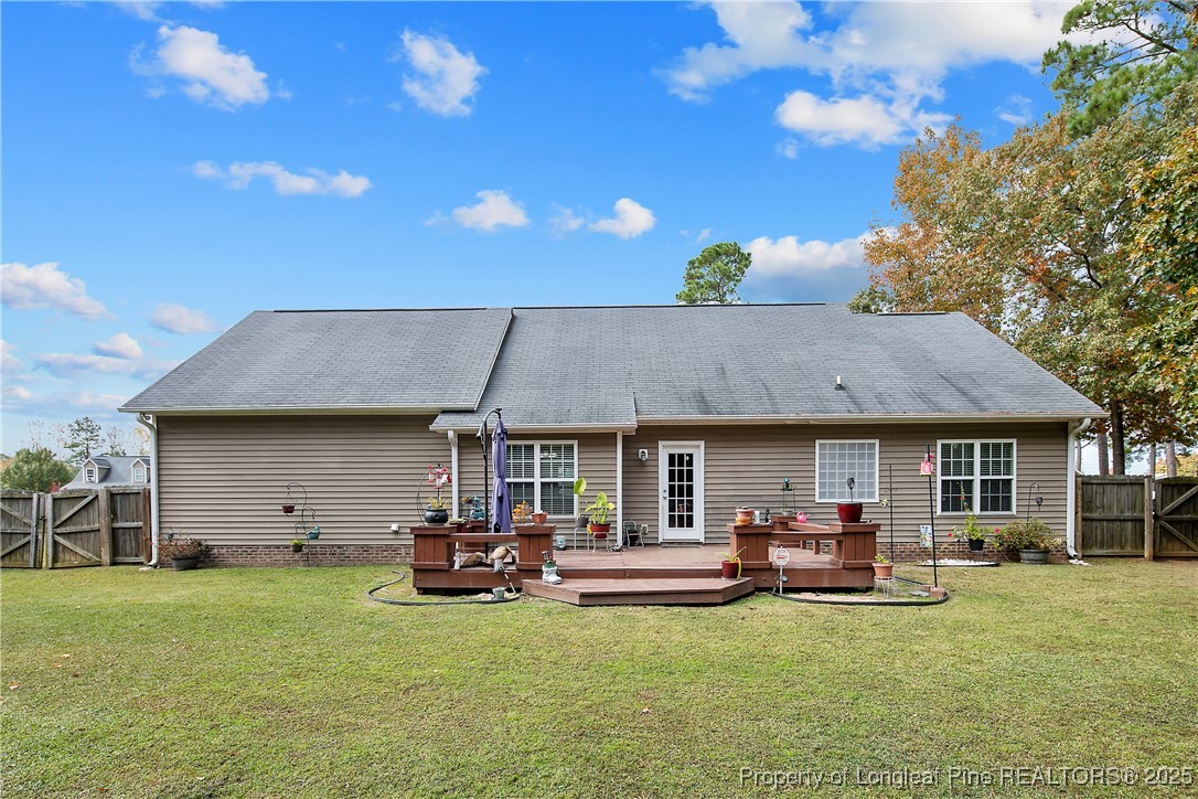 245 Apple Tree Circle Raeford, NC 28376 - Photo 2 of 41 a view of a house with backyard porch and sitting area