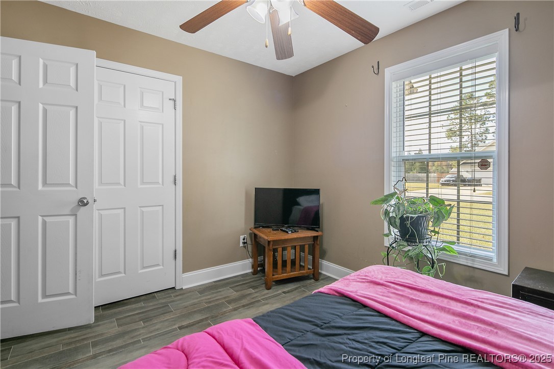 245 Apple Tree Circle Raeford, NC 28376 - Photo 30 of 41 a bed room with a bed and a window