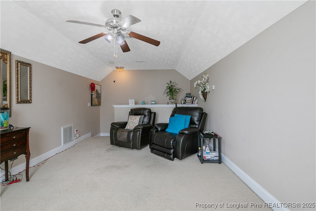 245 Apple Tree Circle Raeford, NC 28376 - Photo 32 of 41 a room with furniture and a ceiling fan