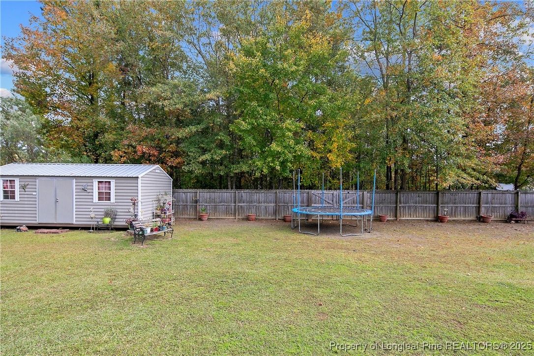 245 Apple Tree Circle Raeford, NC 28376 - Photo 35 of 41 a view of a house with a yard