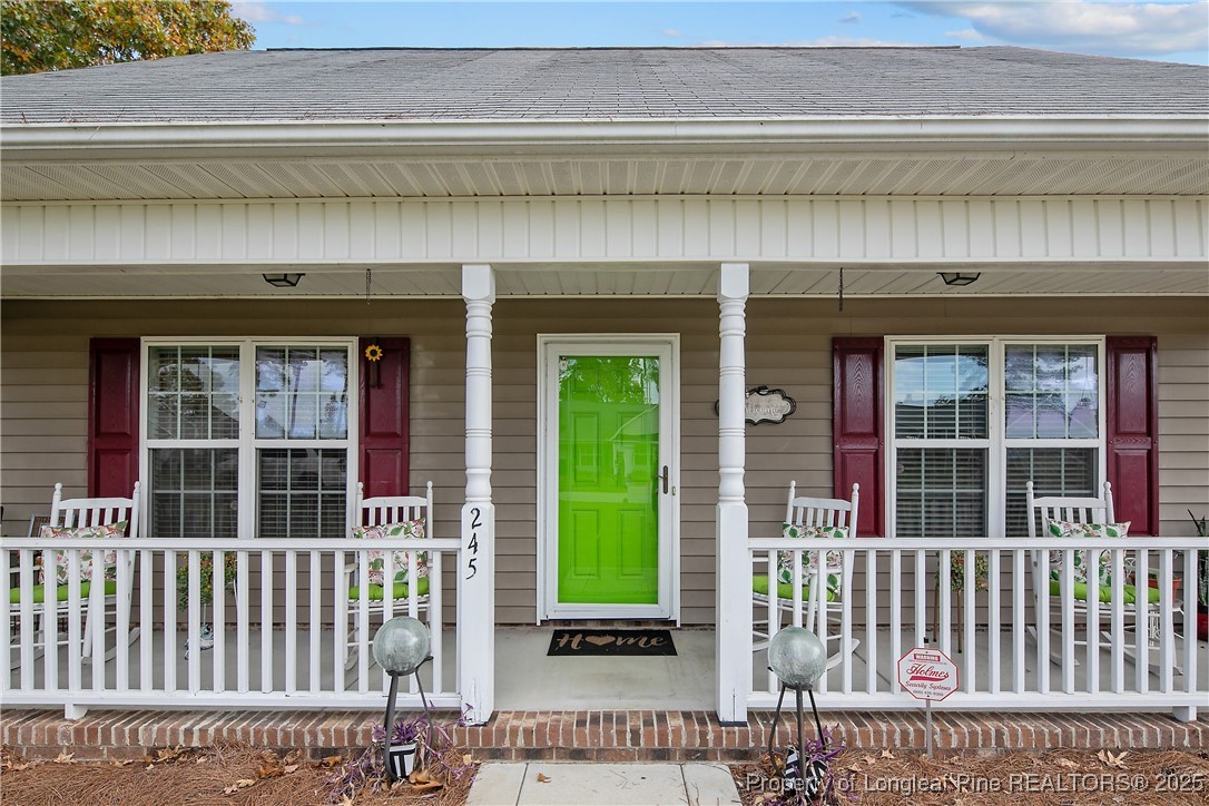 245 Apple Tree Circle Raeford, NC 28376 - Photo 5 of 41 a view of a brick house with large windows