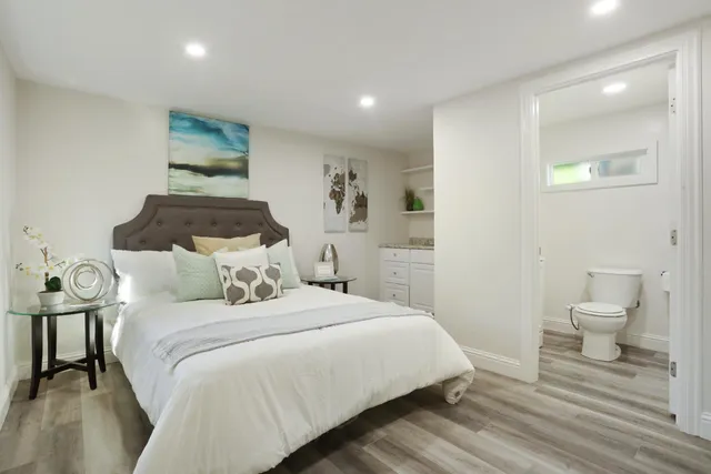 a bedroom with a bed and a view of bathroom