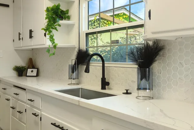 a kitchen with a sink and a window