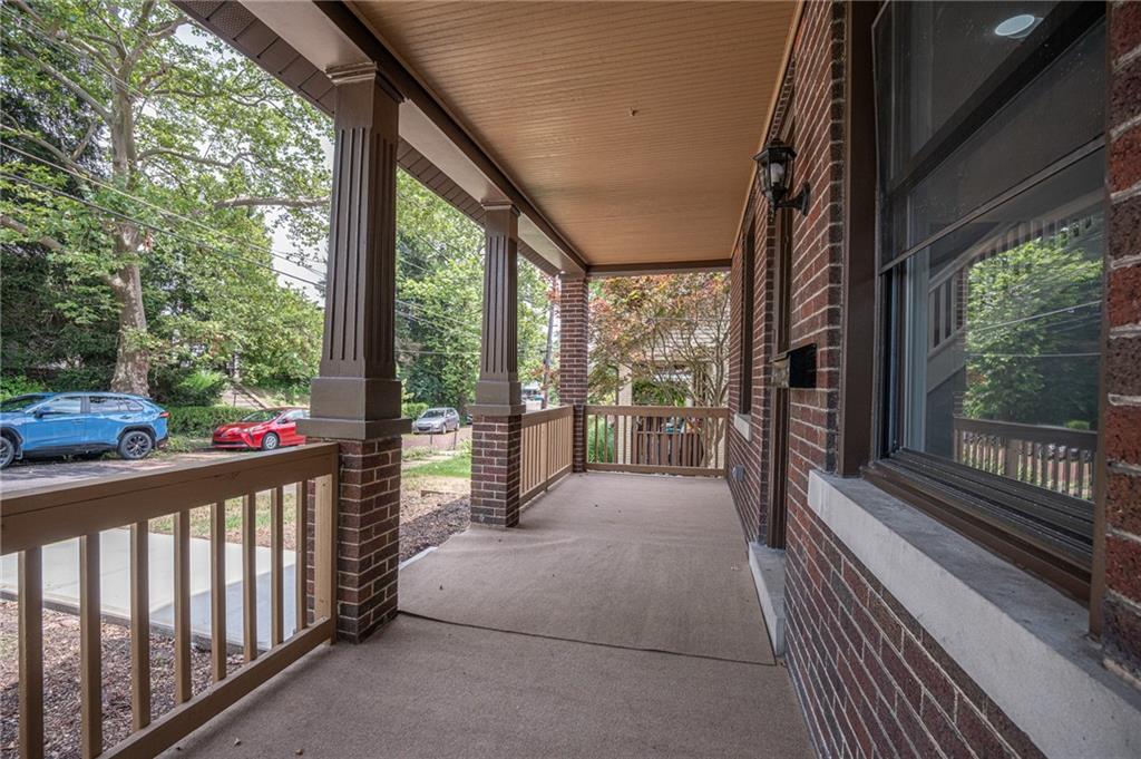 37 Defoe Street Pittsburgh, PA 15214 - Photo 3 of 30 A sprawling front patio that stretches across the width of the house.