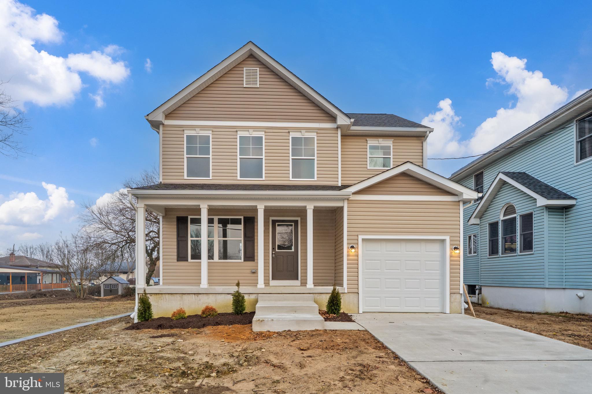 105 West Washington Avenue Magnolia, NJ 08049 - Photo 1 of 31 a front view of a house with a garden