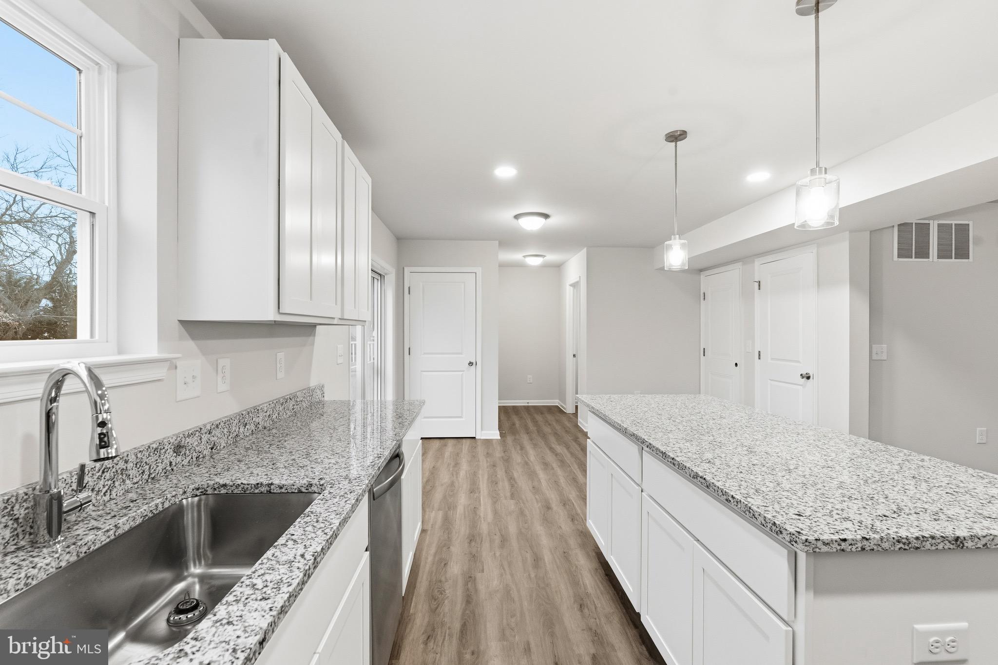 105 West Washington Avenue Magnolia, NJ 08049 - Photo 12 of 31 a kitchen with a sink stove and cabinets