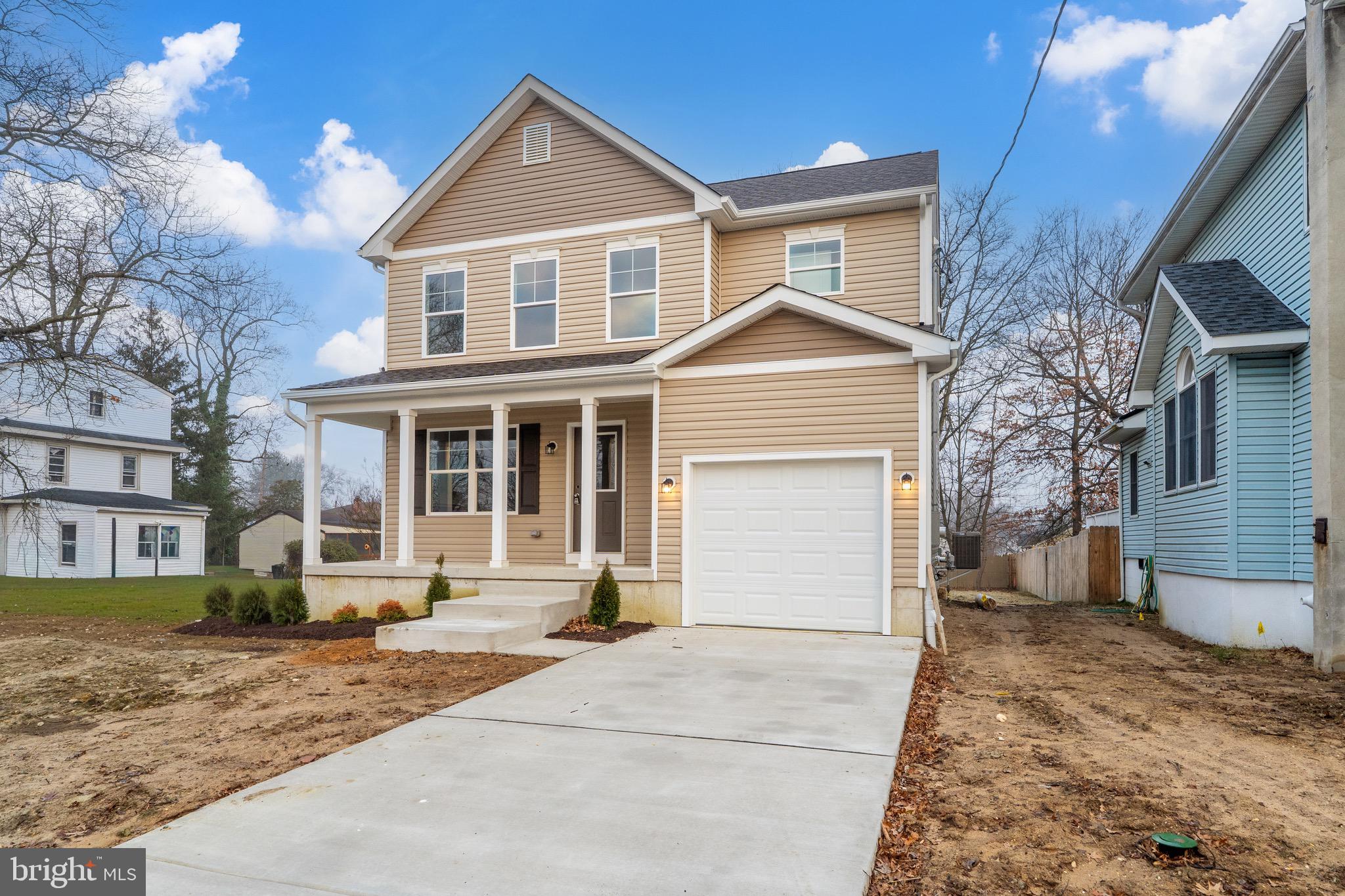 105 West Washington Avenue Magnolia, NJ 08049 - Photo 2 of 31 a front view of a house with a yard