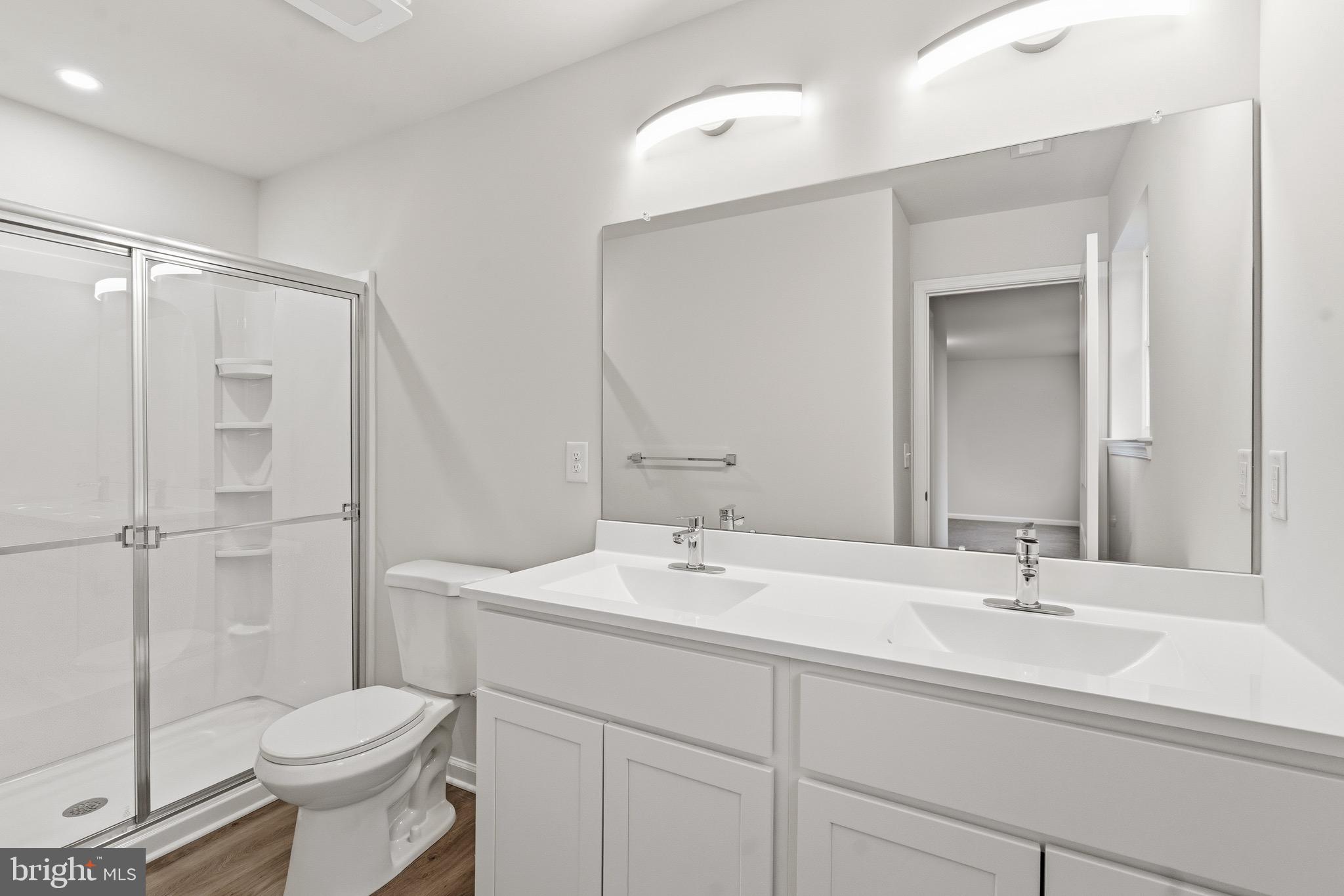 105 West Washington Avenue Magnolia, NJ 08049 - Photo 23 of 31 a bathroom with a sink toilet and a mirror