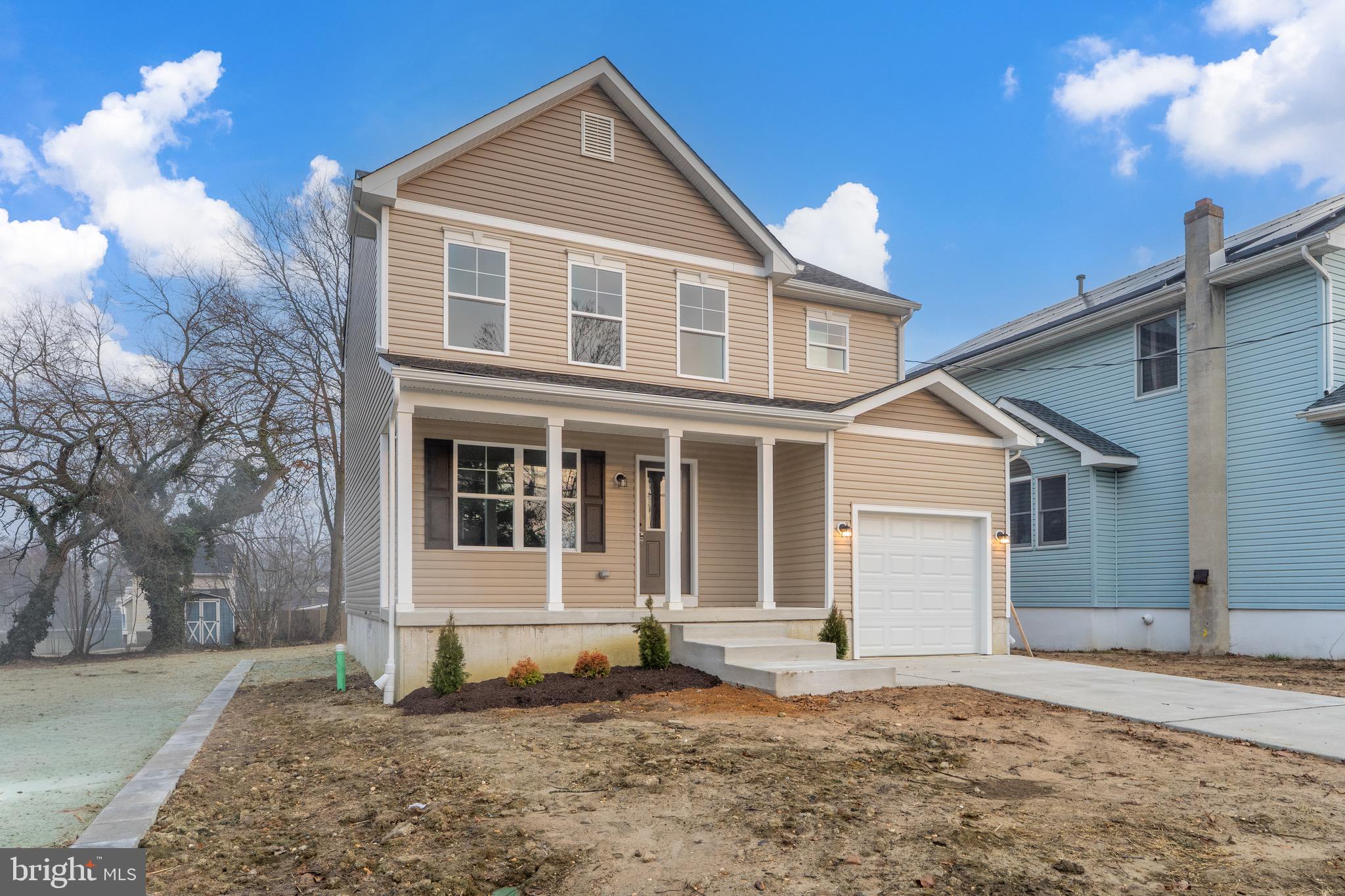 105 West Washington Avenue Magnolia, NJ 08049 - Photo 3 of 31 a front view of a house with a yard