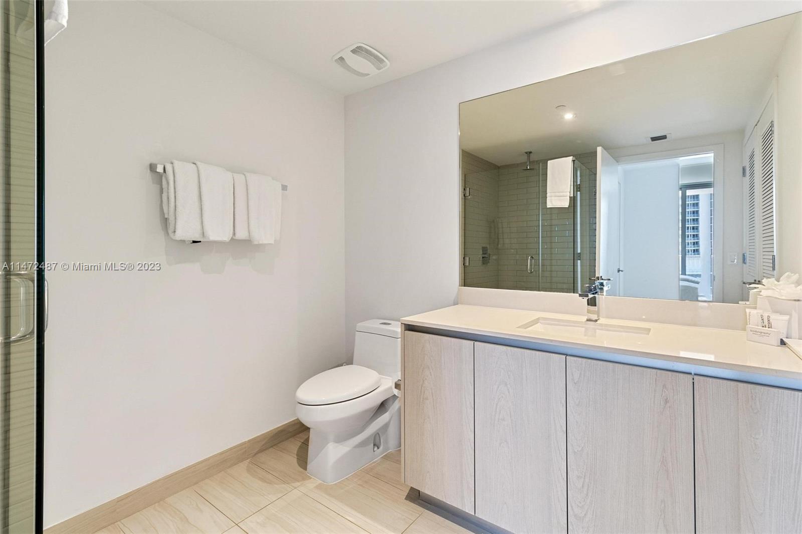 4010 South Ocean Drive, Unit R1107 Hollywood, FL 33019 - Photo 22 of 25 a bathroom with a sink and a toilet