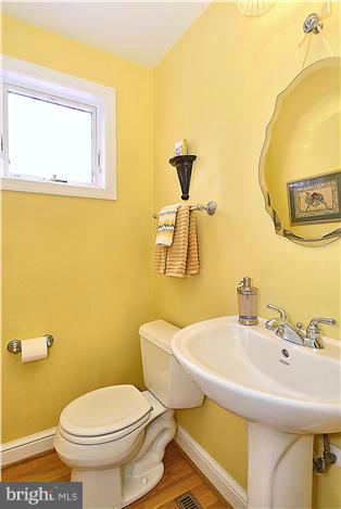 10017 Portland Road Silver Spring, MD 20901 - Photo 14 of 30 a bathroom with a sink and a toilet