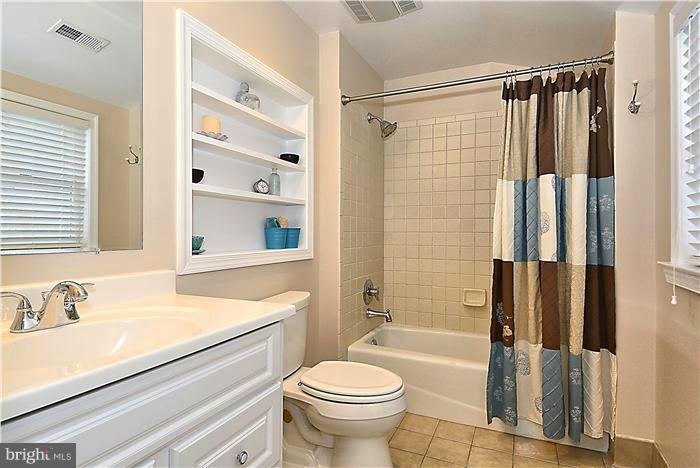 10017 Portland Road Silver Spring, MD 20901 - Photo 18 of 30 a bathroom with a sink toilet and shower
