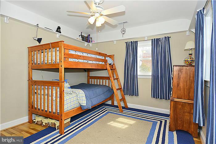 10017 Portland Road Silver Spring, MD 20901 - Photo 20 of 30 a bedroom with a bed and a window