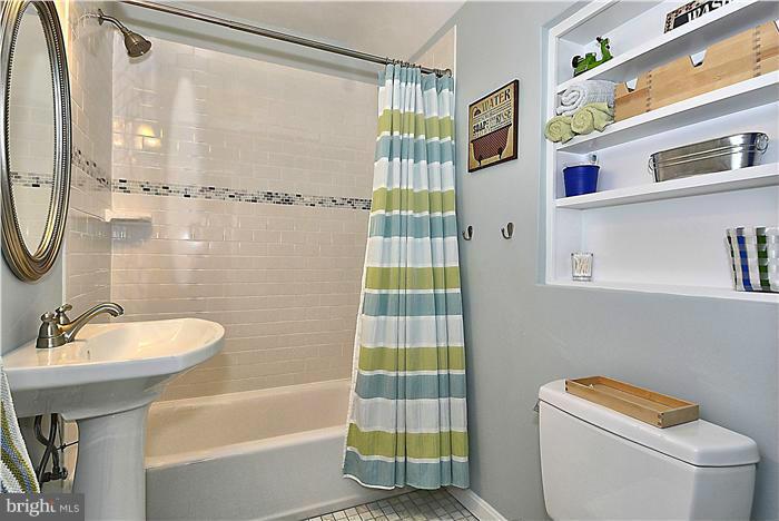 10017 Portland Road Silver Spring, MD 20901 - Photo 24 of 30 a bathroom with a sink a toilet and shower