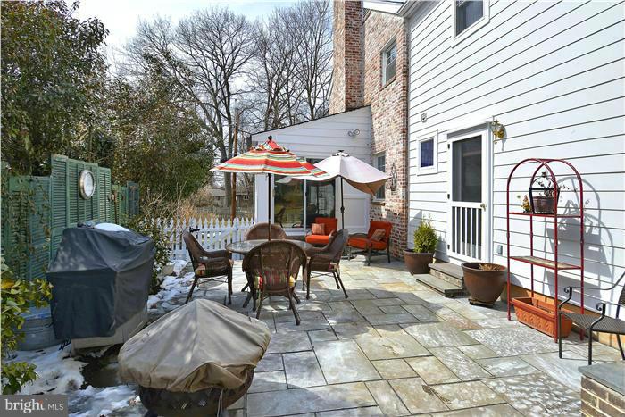 10017 Portland Road Silver Spring, MD 20901 - Photo 27 of 30 a patio with glass top table and chairs