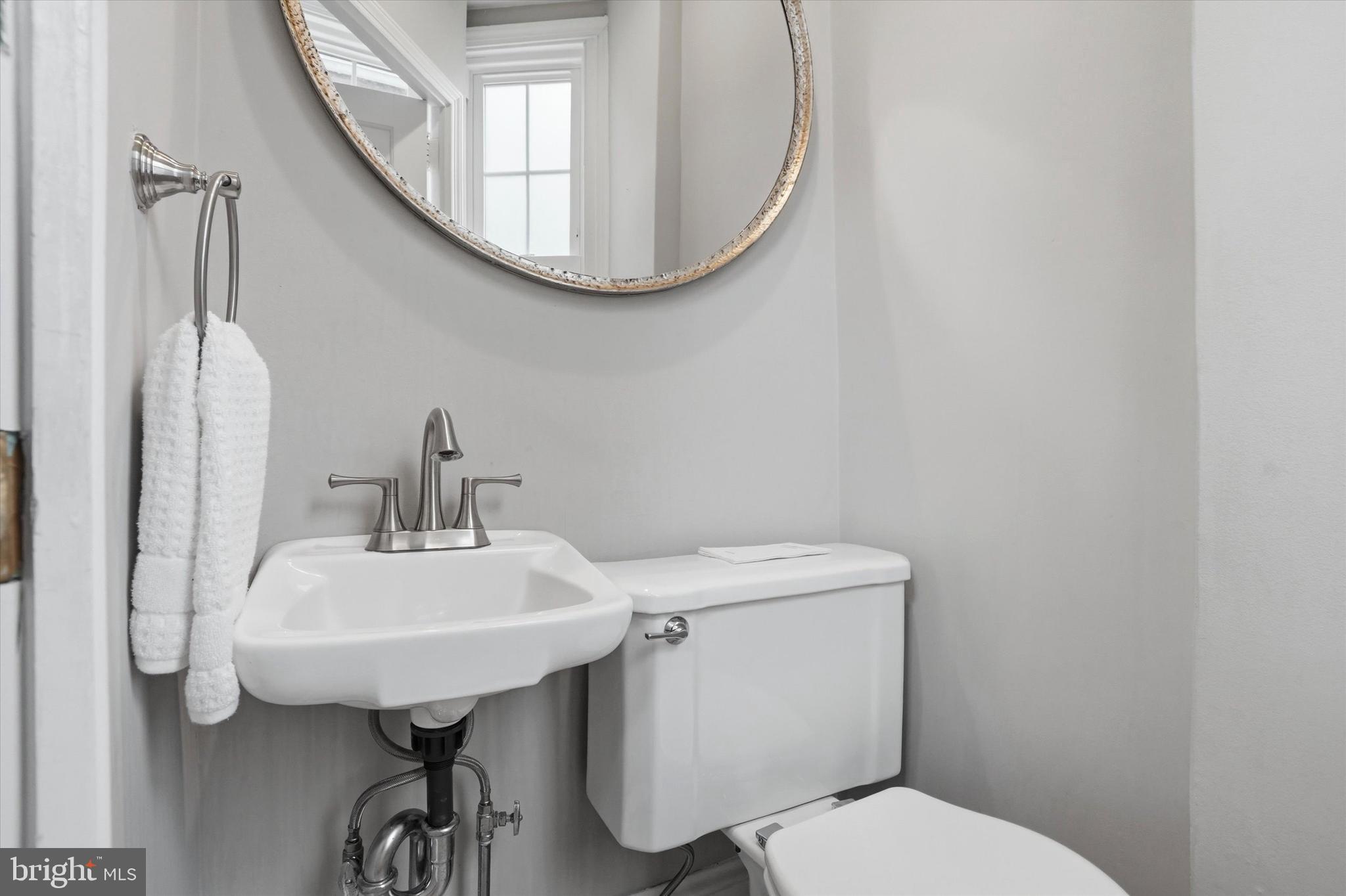 507 Murdoch Road Philadelphia, PA 19119 - Photo 19 of 52 a bathroom with a sink mirror and toilet