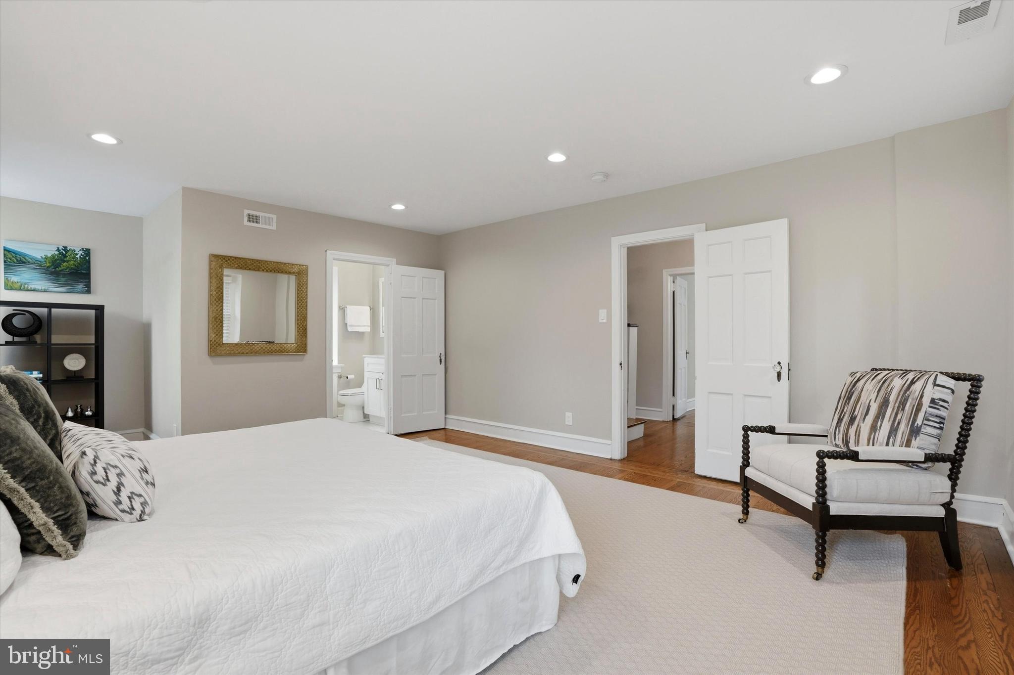 507 Murdoch Road Philadelphia, PA 19119 - Photo 21 of 52 a spacious bedroom with a bed and a couch