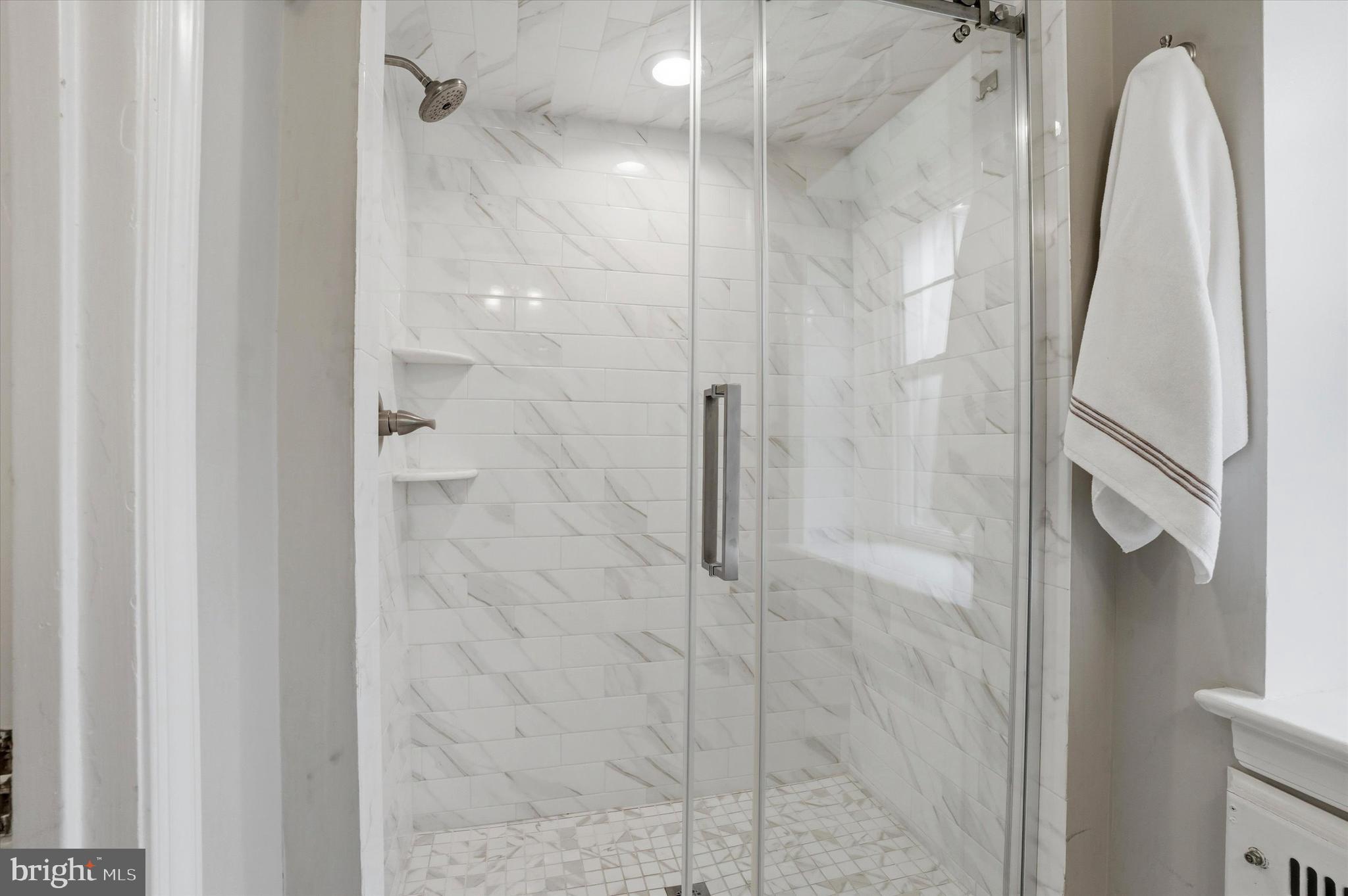 507 Murdoch Road Philadelphia, PA 19119 - Photo 24 of 52 a bathroom with a shower and a glass door