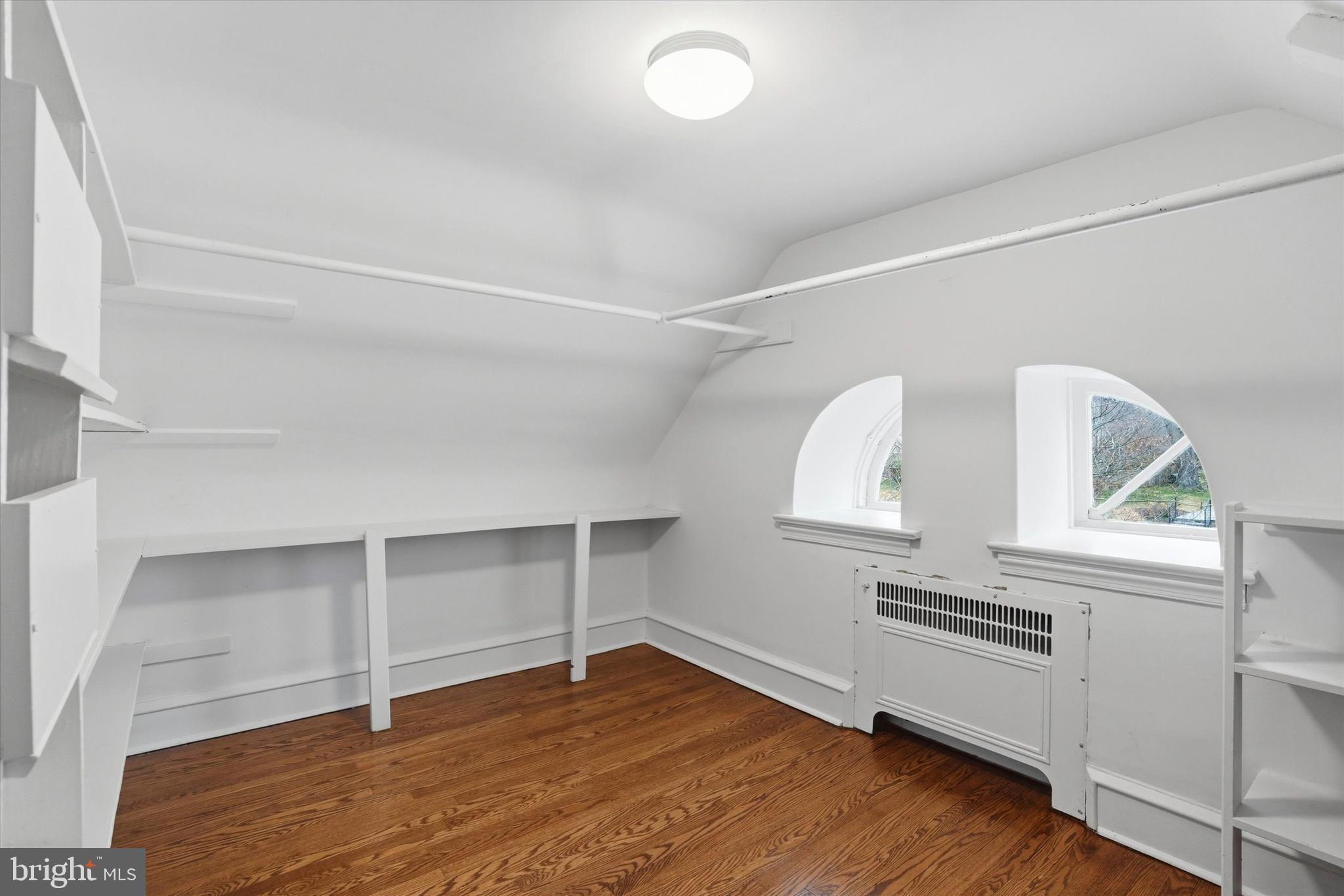 507 Murdoch Road Philadelphia, PA 19119 - Photo 25 of 52 a view of an empty room with wooden floor and a window