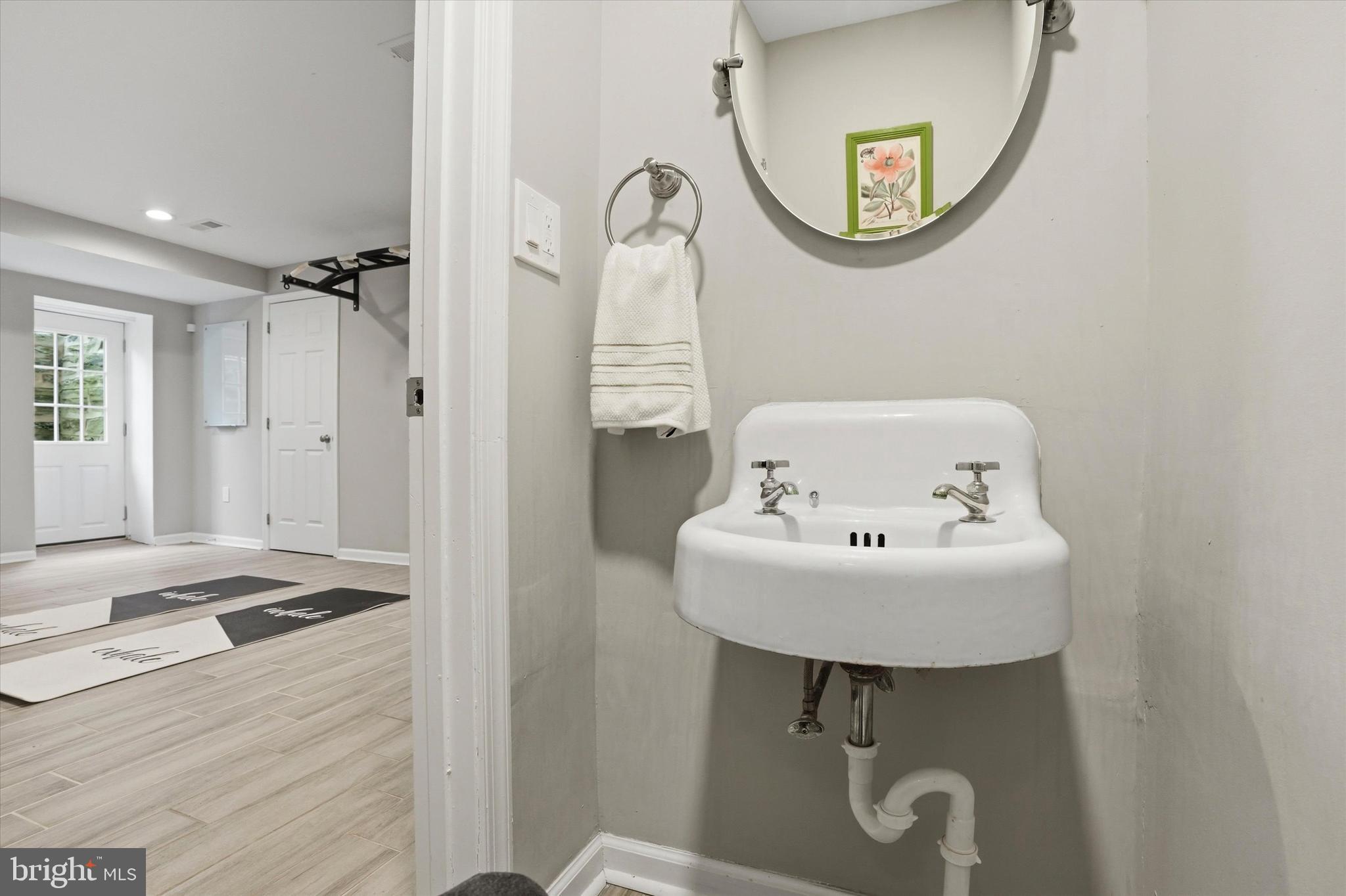 507 Murdoch Road Philadelphia, PA 19119 - Photo 34 of 52 a bathroom with a sink a mirror and a shower