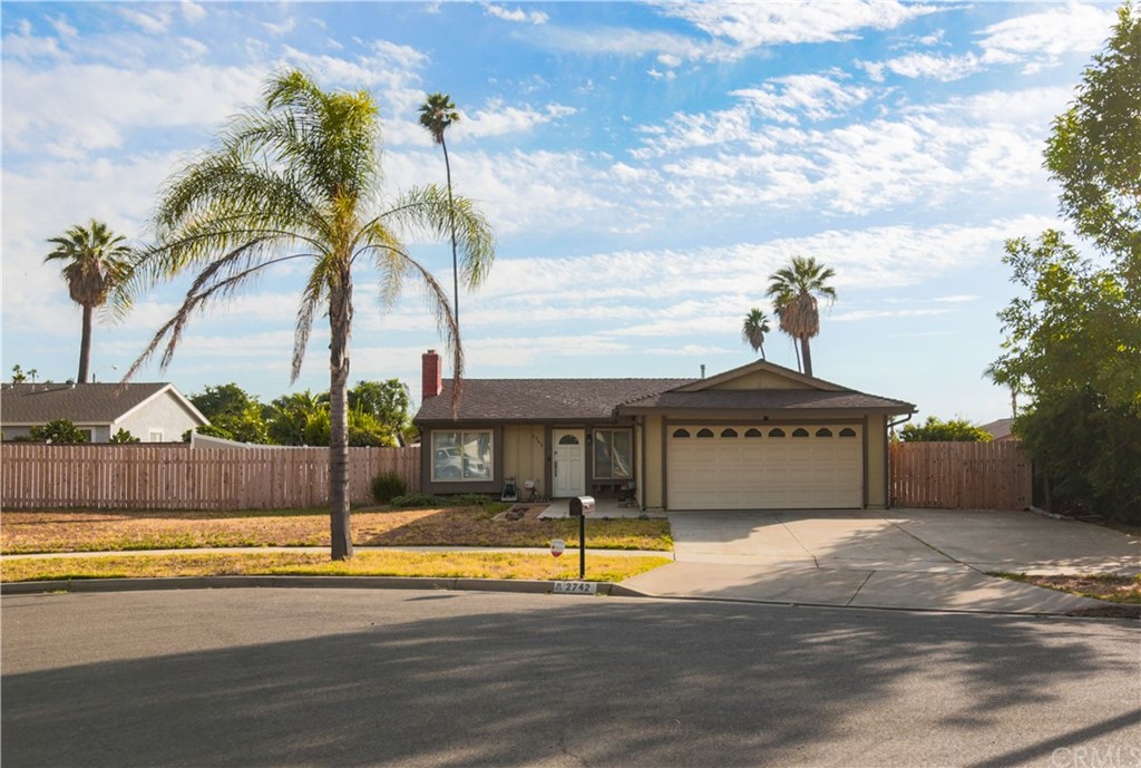 2742 Moorgate Place Riverside, CA 92506 - Photo 1 of 1 a view of a swimming pool with a lawn chairs under palm trees