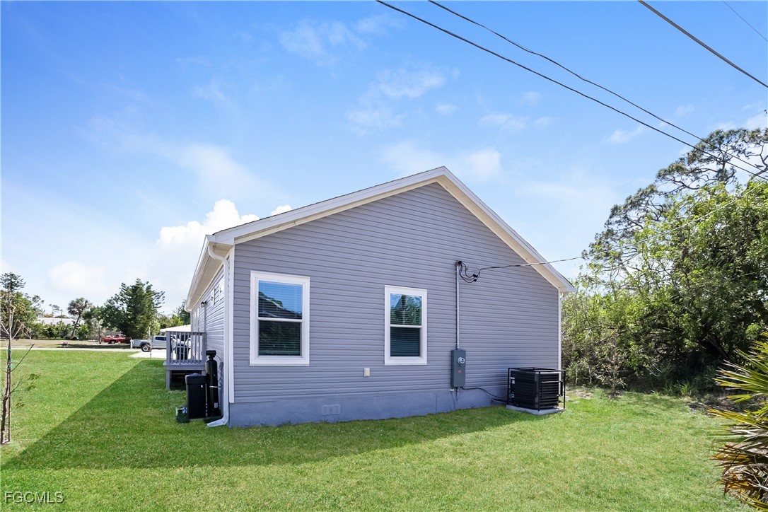 12319 Tangier Street North Port, FL 34287 - Photo 15 of 16 a backyard of a house with lots of green space