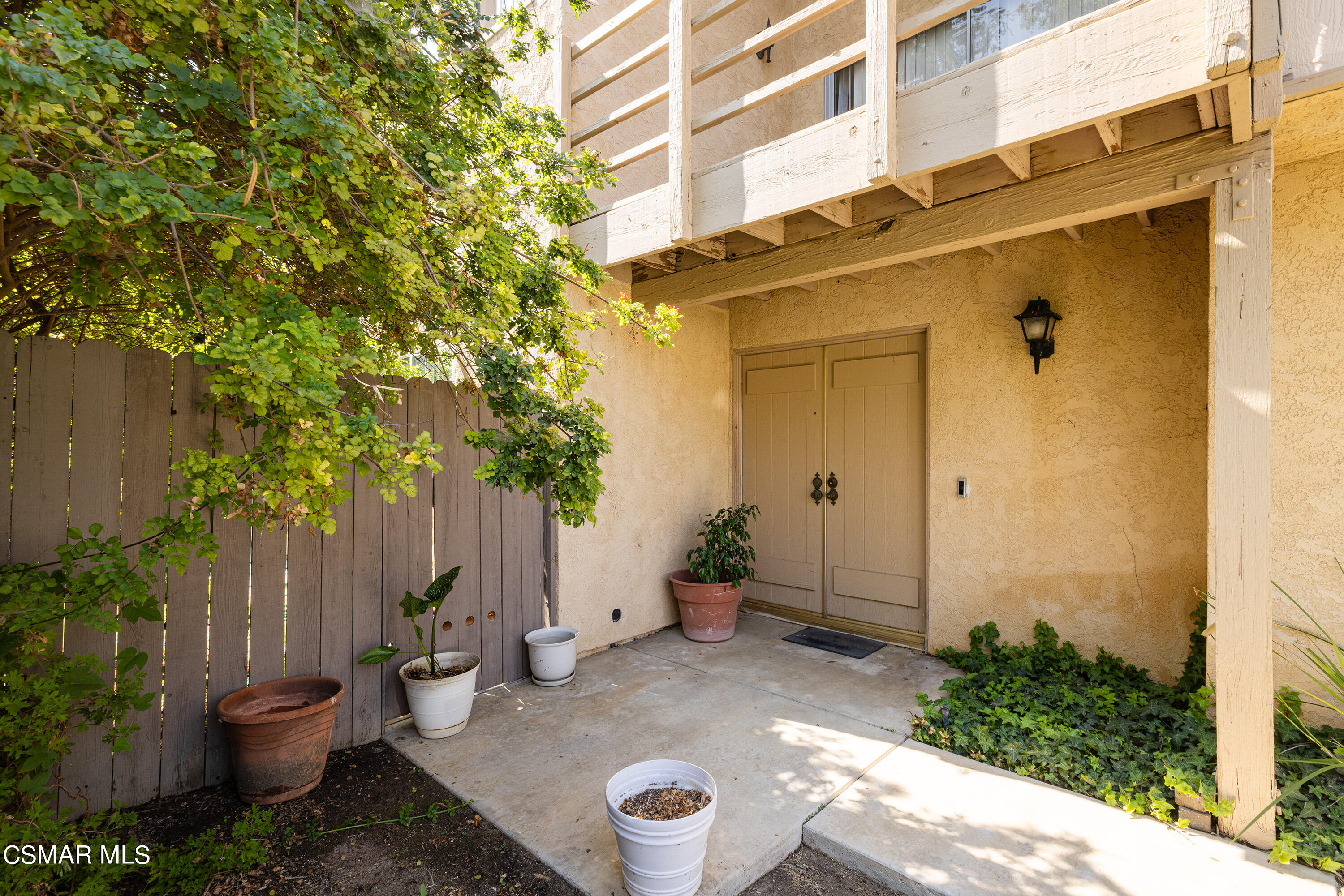 5705 Cochran Street Simi Valley, CA 93063 - Photo 3 of 27 a view of a backyard with plants and potted plants
