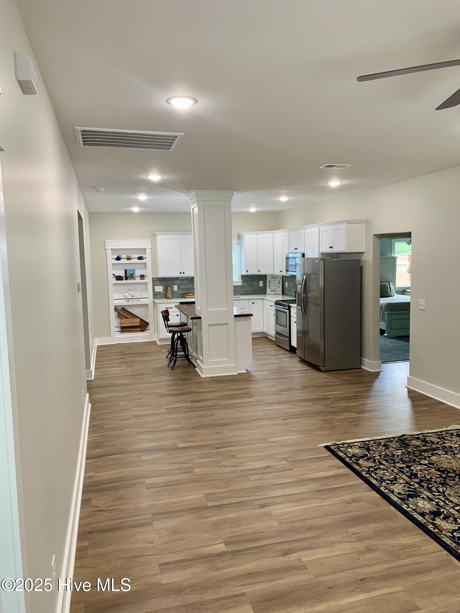 599 Bitmore Road Whiteville, NC 28472 - Photo 4 of 23 View from front door through the living room into the dining/kitchen.