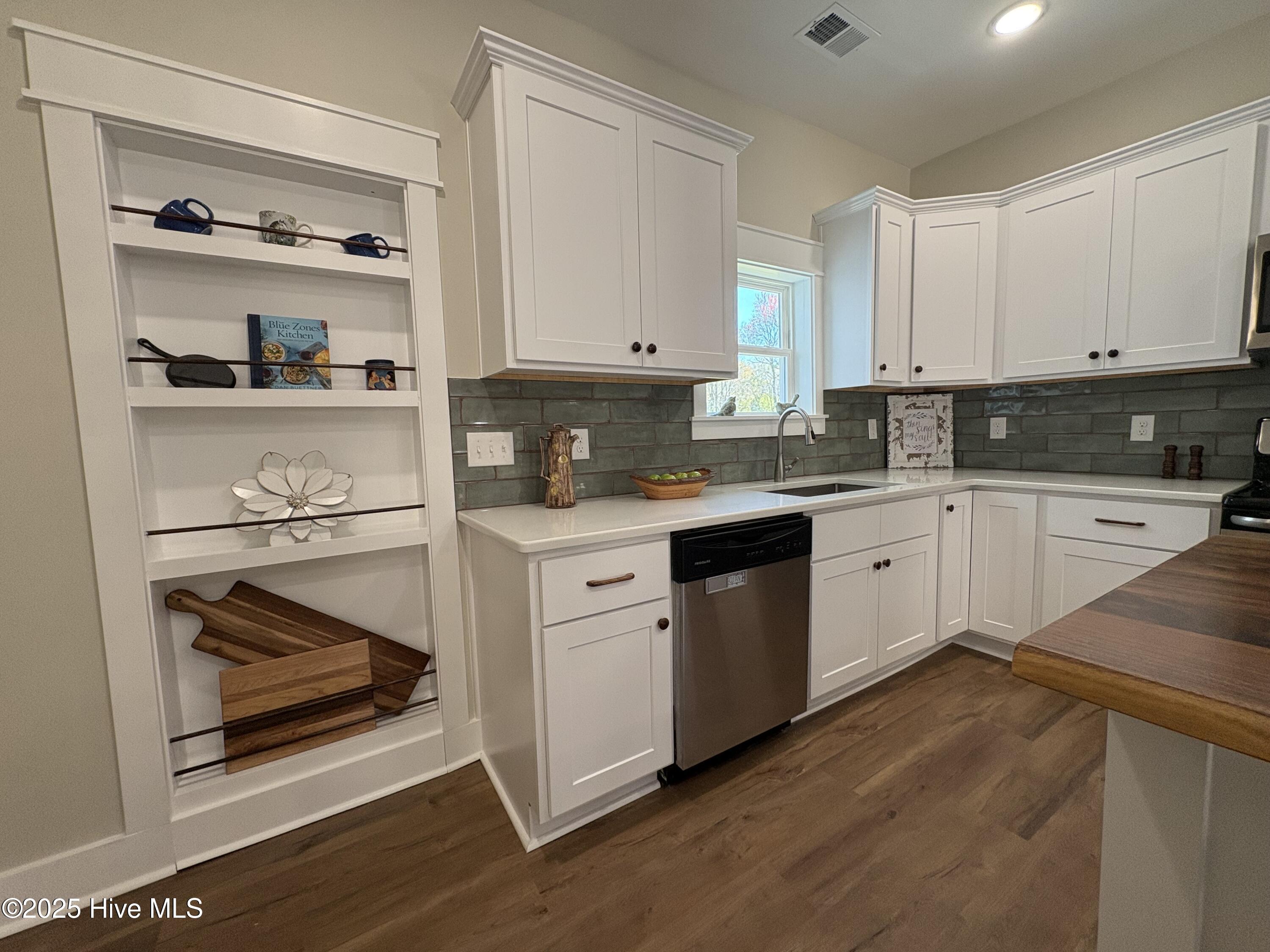 599 Bitmore Road Whiteville, NC 28472 - Photo 9 of 23 It's not just a cabinet...it's your secret passage to the laundry and pantry.