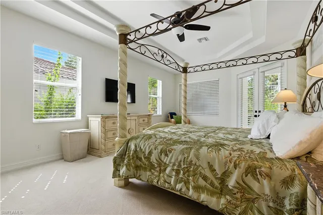 a spacious bedroom with a bed and a walk in closet